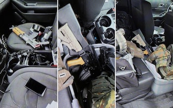 Assault-style rifles are pictured strewn across the vehicle which allegedly belongs to Vance Luther Boelter